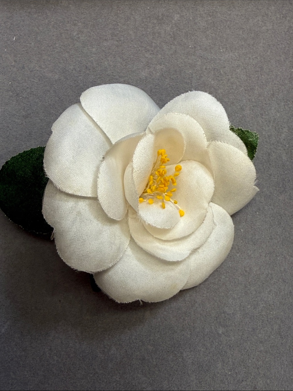 CHANEL Cream Camellia Pin with Yellow Center and Green Leaves